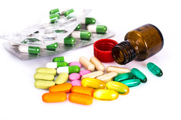 Colored capsules, pills and medical glass bottle