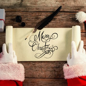 Composite image of close-up of santa claus opening scroll