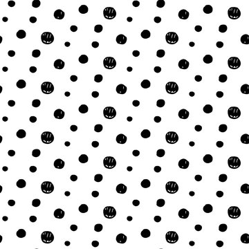 Abstract doodle pattern with hand drawn polka dots. Cute vector black and white doodle pattern. Seamless monochrome doodle pattern for fabric, wallpapers, wrapping paper, cards and web backgrounds.
