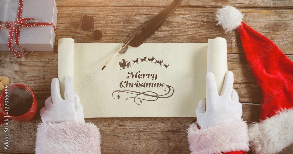 Poster composite image of close-up of santa claus opening scroll