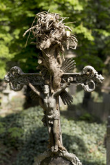 Historic Jesus on the mystery old Prague Cemetery, Czech Republic