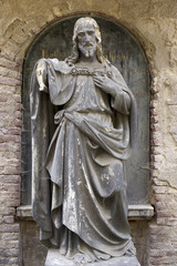 Historic Jesus on the mystery old Prague Cemetery, Czech Republic