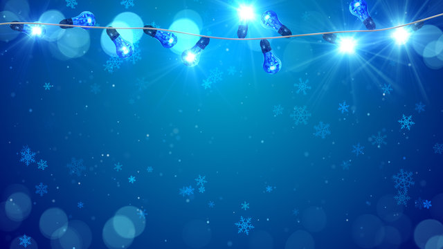 christmas blue light bulbs and snowfall
