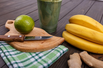 healthy smoothie with bananas,lime and ginger lie on the table
