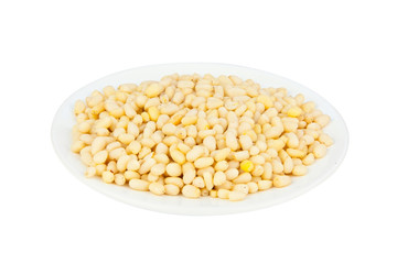 resh peeled pine nuts on  white
