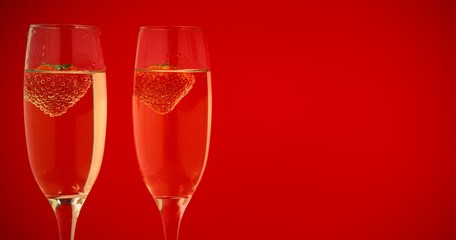 Two glasses of champagne with strawberries