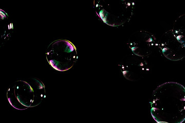 Soap bubbles isolated on black background