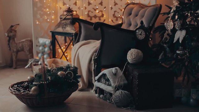 Christmas interior with armchair and a tree in shades of gray