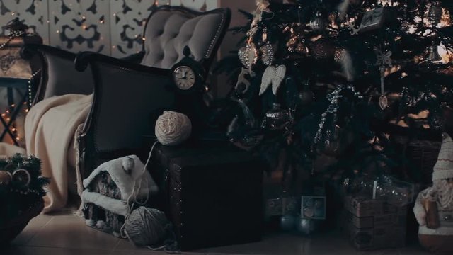 Christmas interior with armchair and a tree in shades of gray