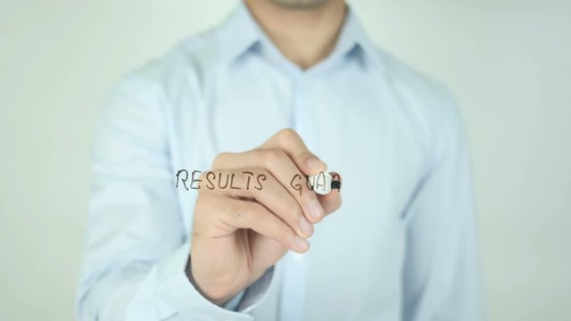 Results Guaranteed, Man Writing on Screen