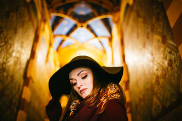 fashion style portrait of young trendy girl in fashionable hat
