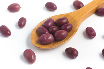 Black olives into a spoon