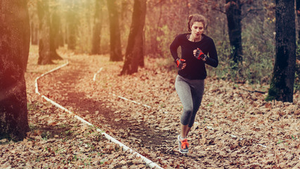 Young woman running at the nature