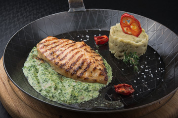 Chicken fillet on a frying pan