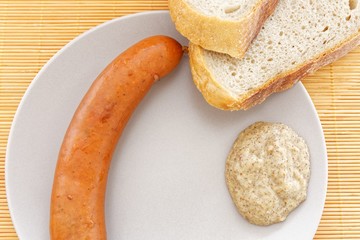 tasty sausages with bread and mustard