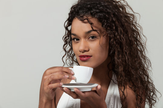 Portrait of a girl with a cup of coffee