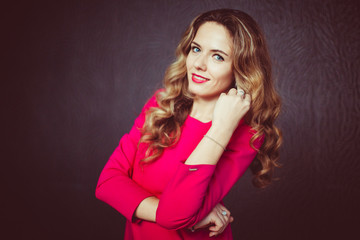 Portrait of beautiful smiling girl with luxuriant hair curling