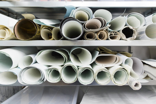 rolls of paper in a cupboard