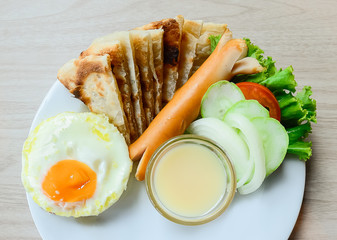 Tea cup, Two eggs and bacon for healthy breakfast