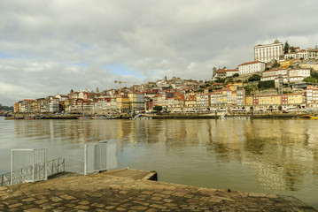 sight of the historical center of Oporto with the pier in the river Douro in Portugal. 
