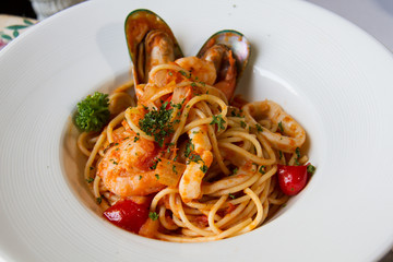 spaghetti sea food on white plate.