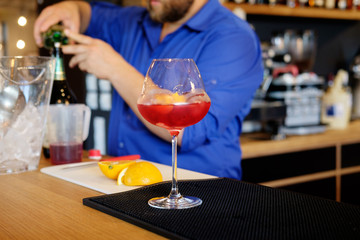 Barman preparing alcoholic cocktail for customer