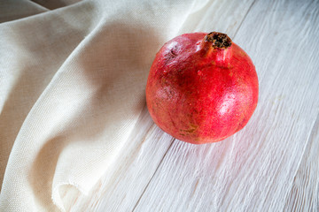 Whole pomegranate on white background
