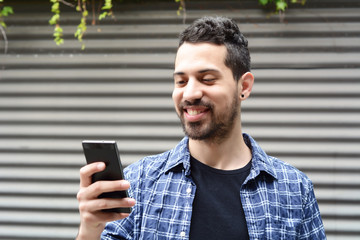 Young man using a smartphone.