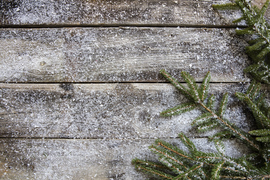 snowy old rustic wooden timbers and fir twigs, flat lay