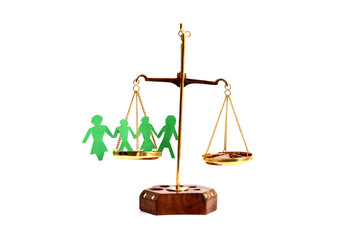 Balance your life concept with scale weighting money and family life isolate on white background