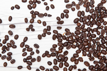closeup of coffee beans on wooden desk
