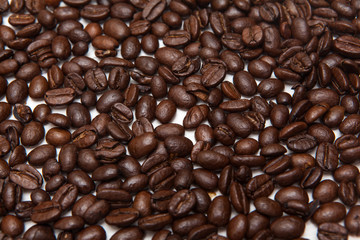 closeup of coffee beans on wooden desk
