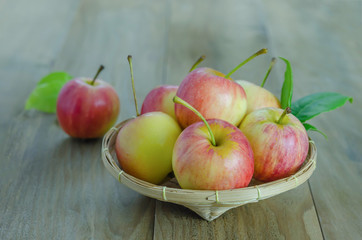 Red and yellow apple   on wooden background