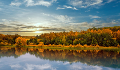 Fototapeta premium Fantastic sunset. evening sun over river. colorful sky. majestic summer landscape. dramatic picturesque summer scene. beauty in the world
