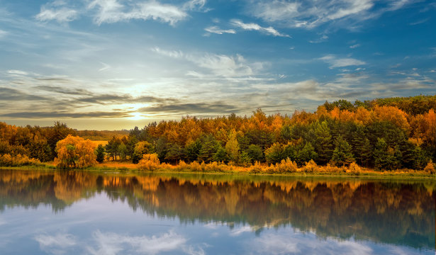   Fantastic sunset. evening sun over river. colorful sky. majestic summer landscape. dramatic picturesque summer scene. beauty in the world