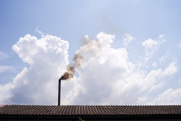 smokestack with black smoke under sky and cloud background. black burning smoke. air pollution form industrial