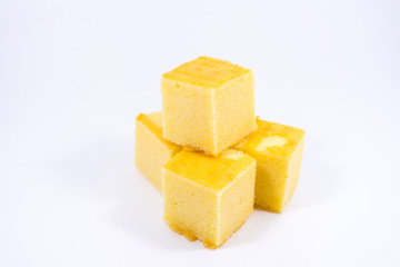 square butter cake on white background. square butter cake stack. butter cake on white.