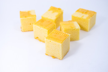 square butter cake on white background. square butter cake stack. butter cake on white.