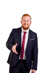 Red-haired executive man with beard offering hand to shake hands. Caucasian man in suit. 