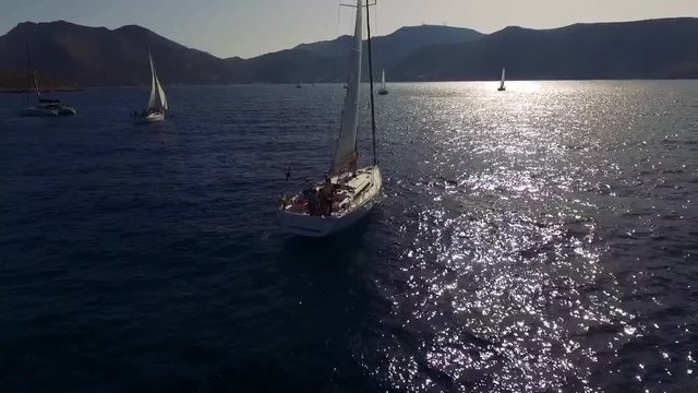Sailing yachts floating in calm sea