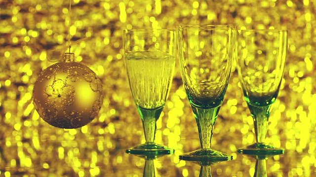 glasses with champagne on a shiny background. Christmas