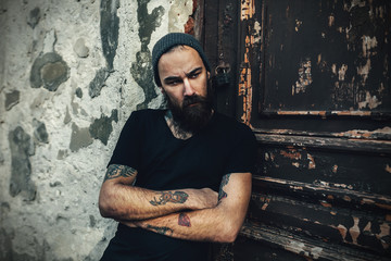 Portrait of brutal bearded man wearing blank t-shirt