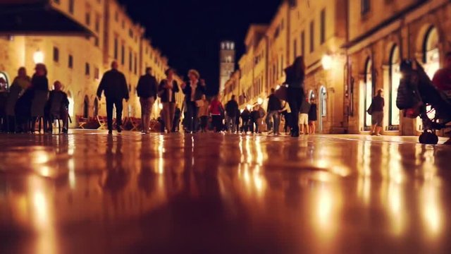 Pedestrians at night. Dubrovnik, Croatia