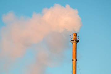 Air pollution with smoke from chimney

