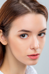 Fototapeta premium The face of woman on gray background