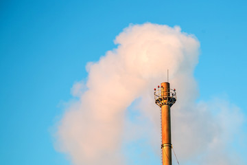 Air pollution with smoke from chimney
