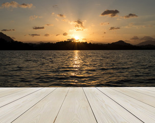 Wood Terrace on The Beach with Sunrise (Sunset) and Silhouette Island of Thailand in Background for Mock up to Display Product or input Text about Scenery Business Travel Background