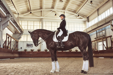 woman jockey with his horse
