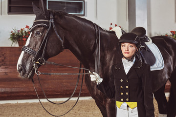 woman jockey with his horse