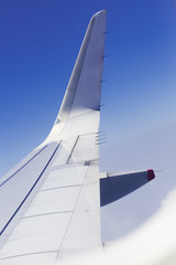 Wings of the Plane on Blue Sky Background